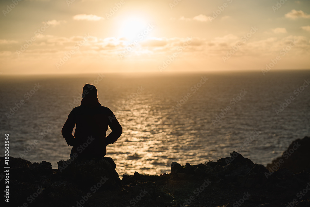 Fototapeta premium Man on the cliffs in Portugal