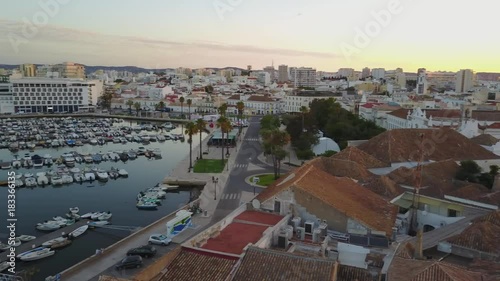 Aerial view of old town, modern architecture, marina and nature, Faro, Portugal