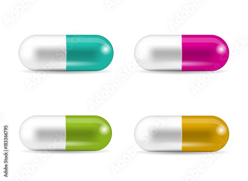 Set of capsule-shaped tablets. Collection of pills in caplet forms. Medicine and drugs.