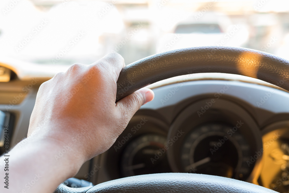 Hand on steering wheel Stock Photo | Adobe Stock