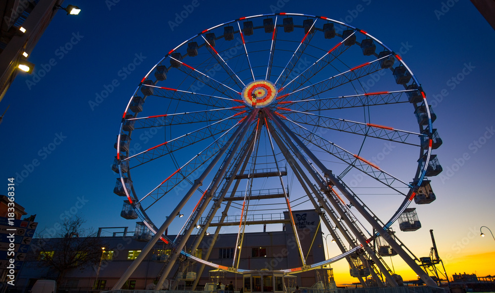 GENOA, ITALY, NOVEMBER 27, 2017 - Ferris wheel with colored lights in 