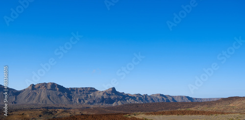 mountain landscape panorama, desert valley with clear blue sky background -