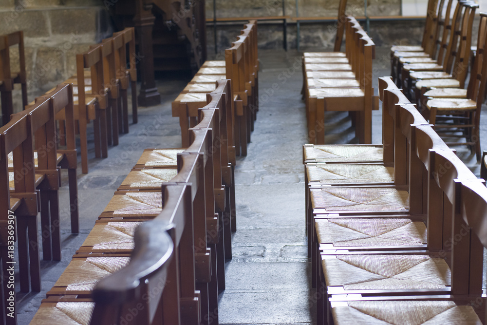 Wooden chairs inside a old church Wooden chairs inside a old church