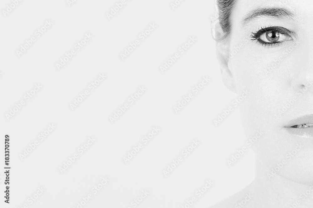 Naklejka premium High key portrait of a woman with only half of her face