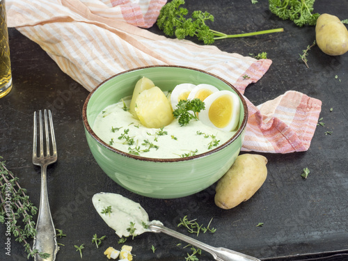 green sauce with eggs, potatoes and apple wine