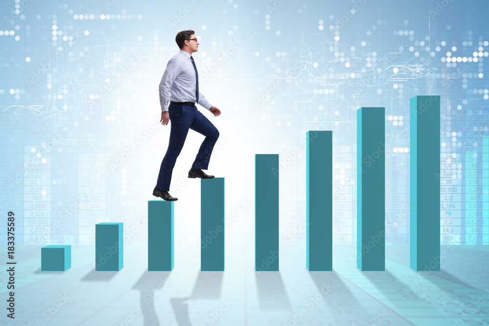 Fototapeta premium Businessman going up the bar chart in growth concept