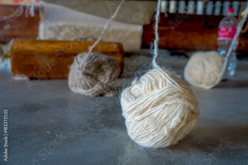 Close up of a whool to work on loom manufacturing whool shawl clothing in Nepal photo