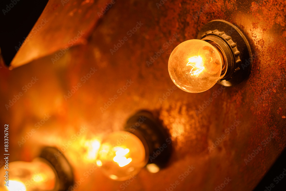 Burning light bulbs on the wall