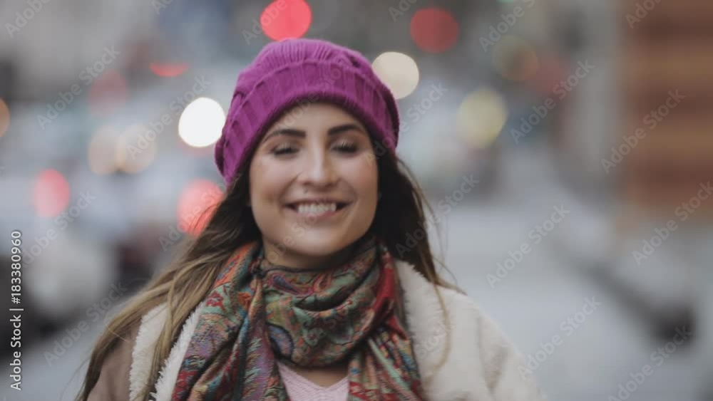 Good bye gesture of young woman in cold city street Good bye gesture of young woman in cold city street