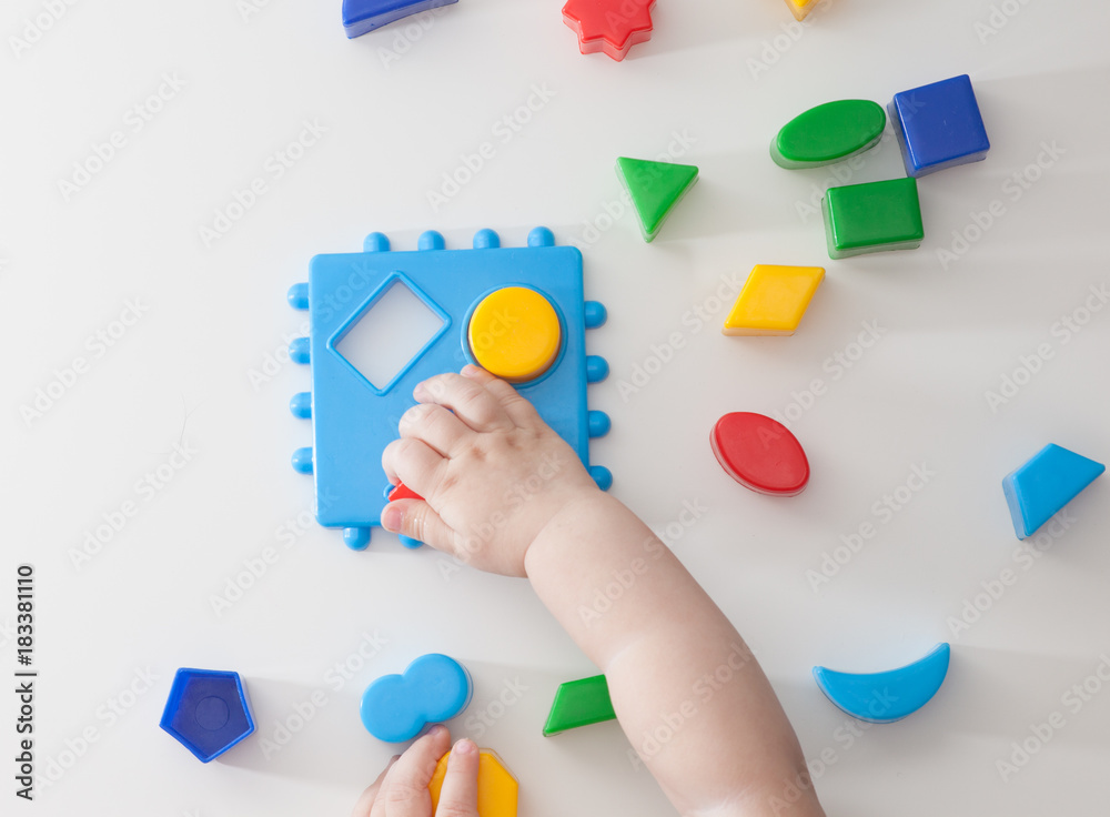 Children playing with montessori toys, educational toys, arranging and sorting colors and sizes. Children playing with montessori toys, educational toys, arranging and sorting colors and sizes.
