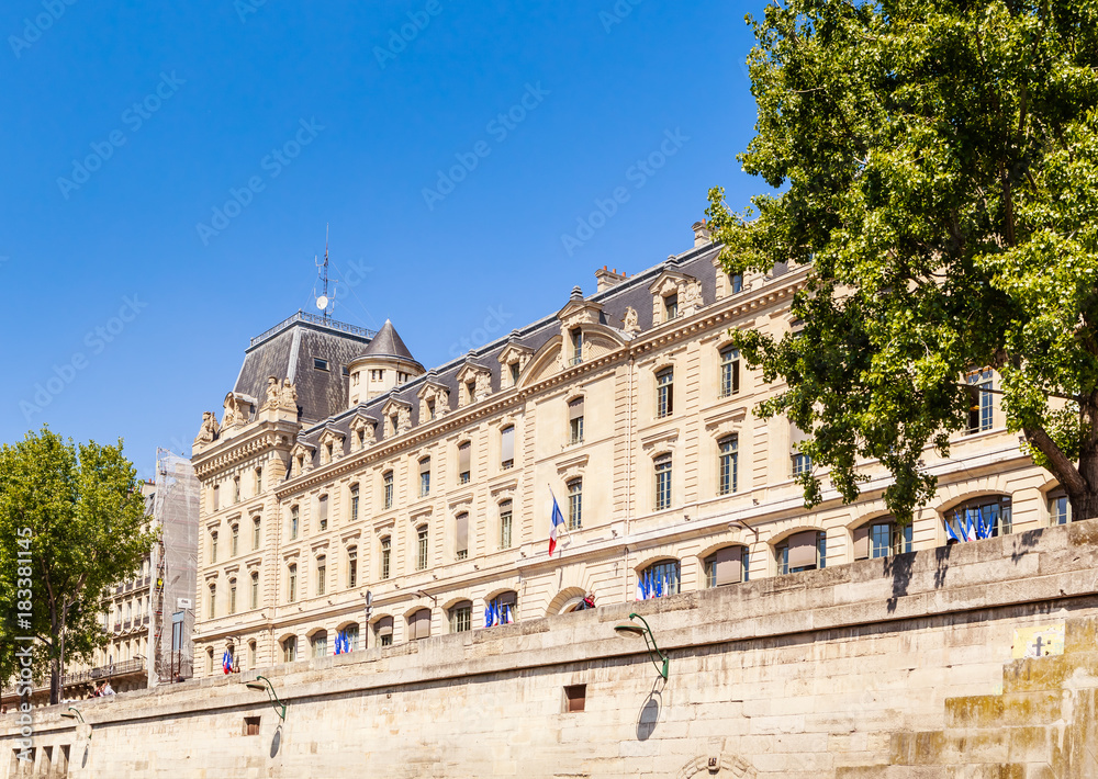 Part of the building of Police prefecture from the Seine in the spring. Paris, France