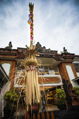Traditional Bali Penjor, bamboo pole with decoration on Balinese people house in Bali photo