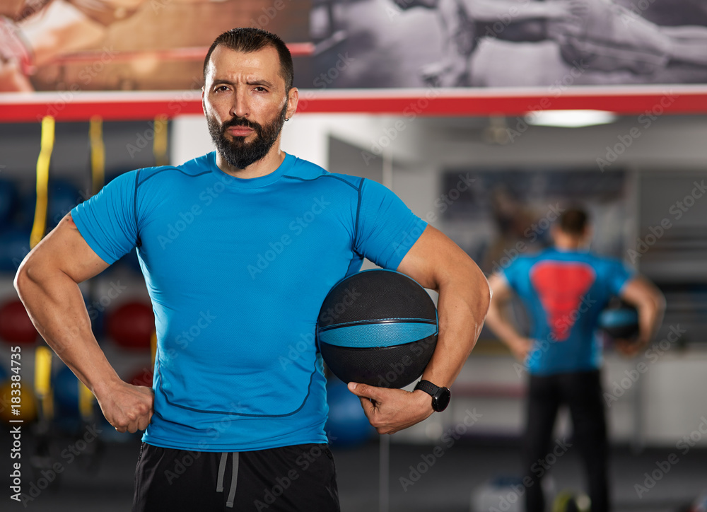 Fitness trainer with medicine ball Fitness trainer with medicine ball