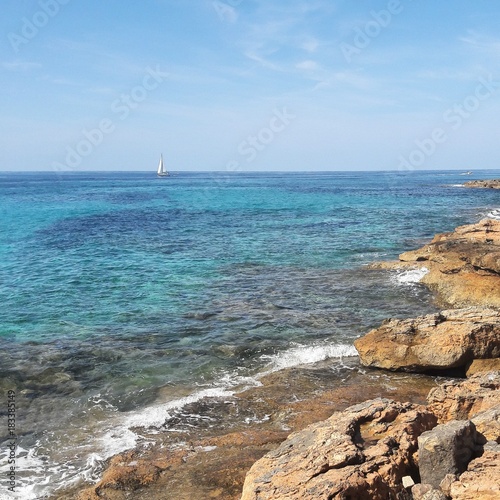 Mediterraean sea view with a boat in the background photo