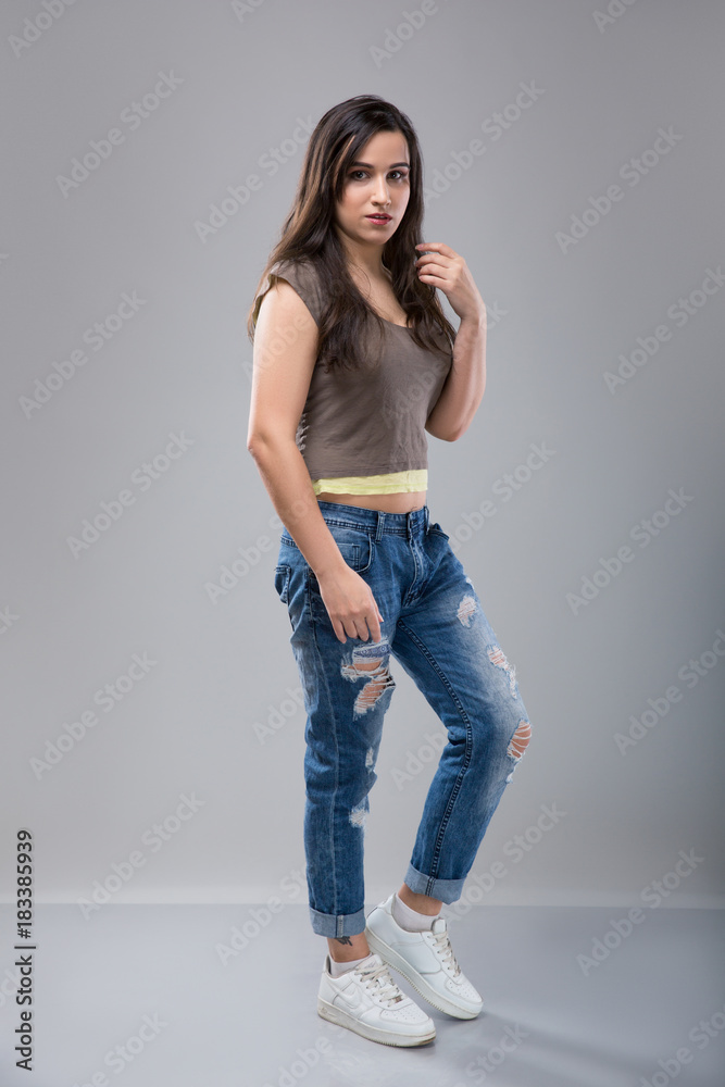 Attractive woman in jeans with brunette hair Attractive woman in jeans with brunette hair
