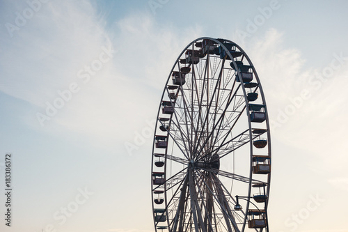 Side view of ferris wheel in amusement park