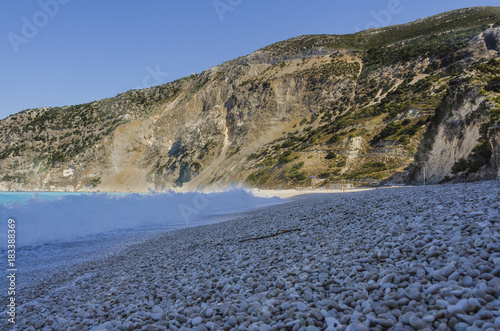 close-up of pebbles and waves at myrtos kefalonia beach photo