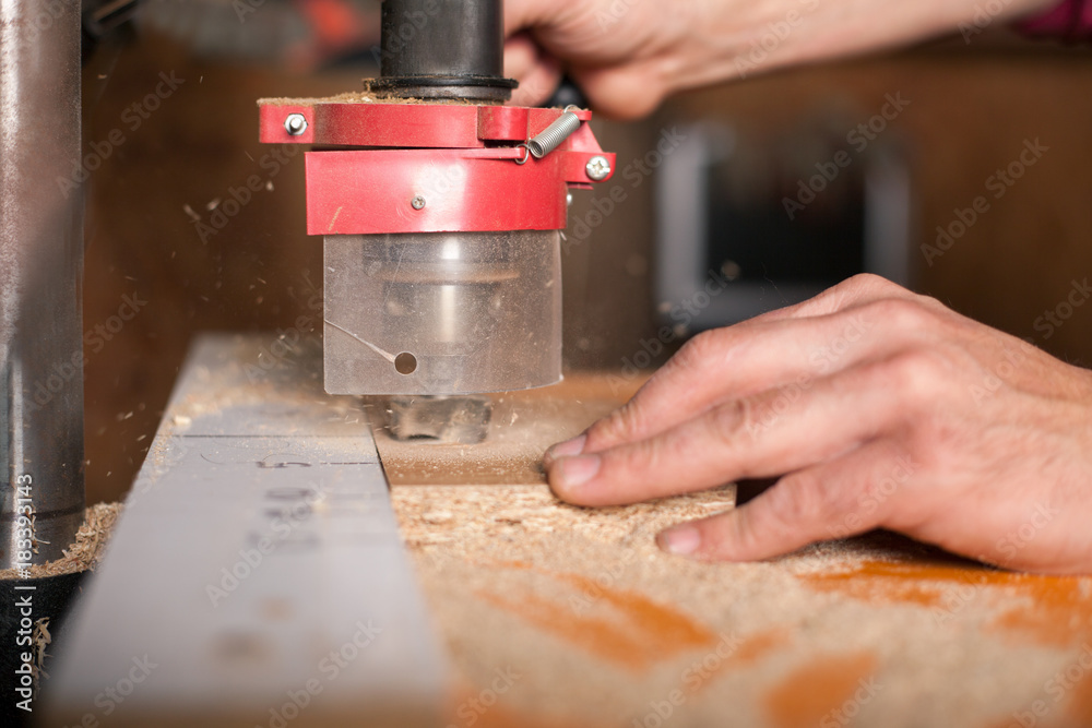 Man doing woodwork in carpentry Man doing woodwork in carpentry