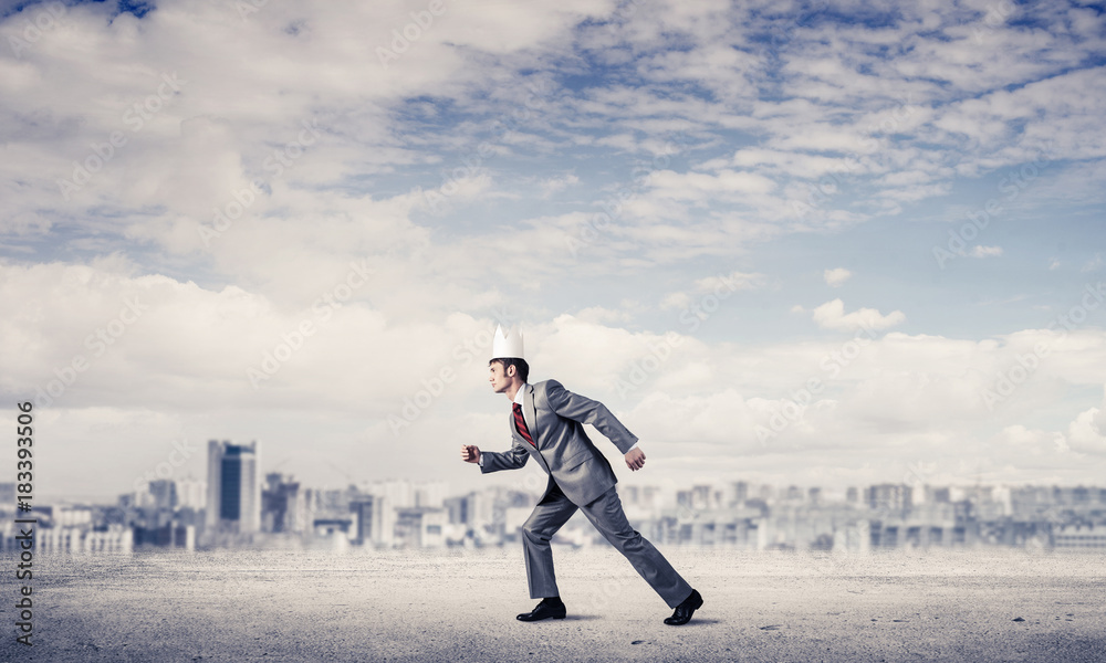 King businessman in elegant suit running and business center at King businessman in elegant suit running and business center at