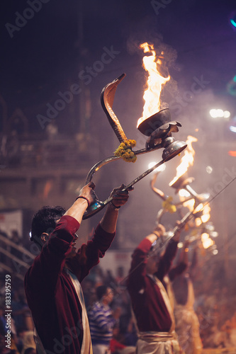VARANASI, INDIA- 23 JANUARY 2017 : A Hindu priest performs the Ganga Aarti ritual in Varanasi