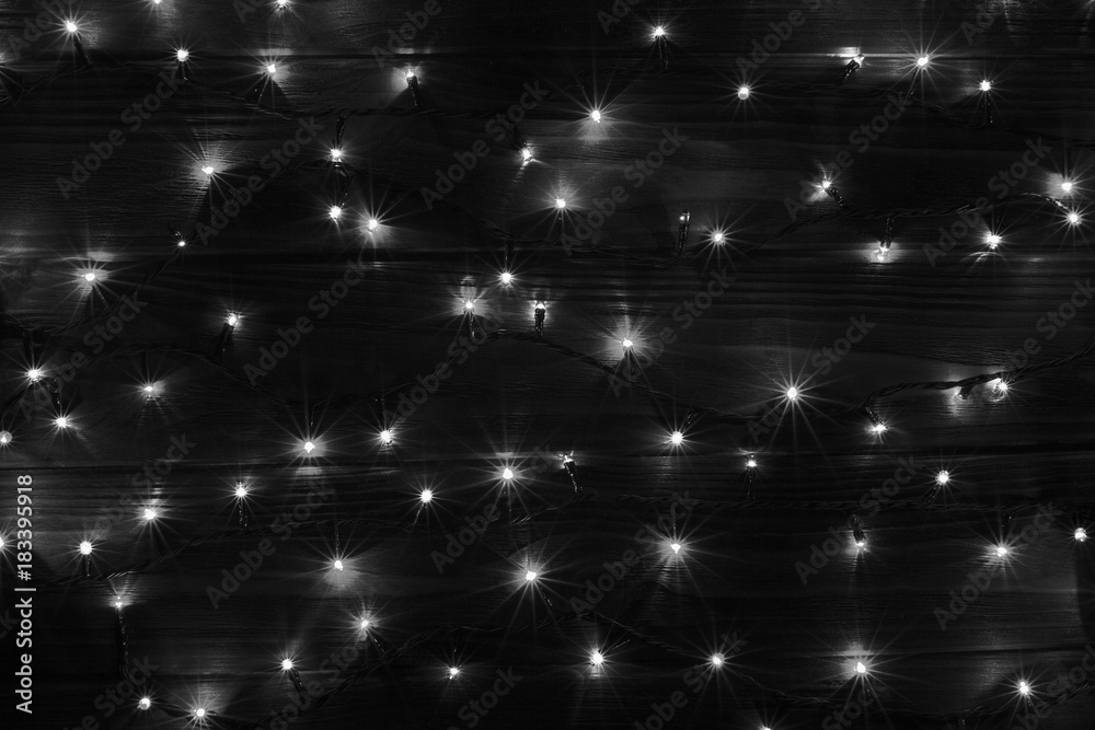 Christmas lights black and white effect background. Stock Photo Adobe