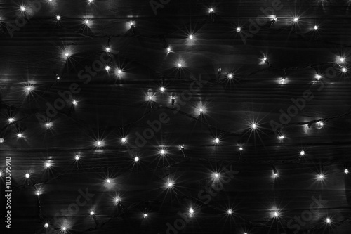 Christmas lights black and white effect background.