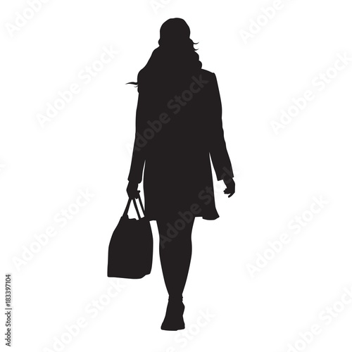 Woman walking with bag in her hand, isolated vector silhouette. Front view