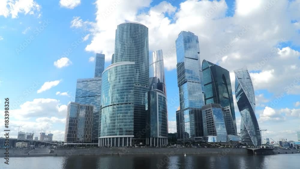 skyscrapers on river bank in summer timelapse skyscrapers on river bank in summer timelapse
