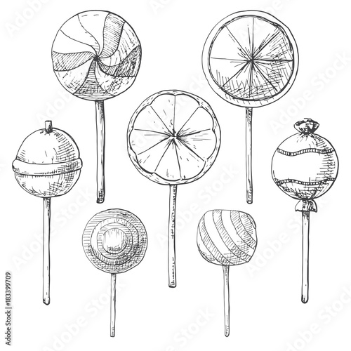 Hand drawn set of different lollipops. Vector illustration of a sketch style.