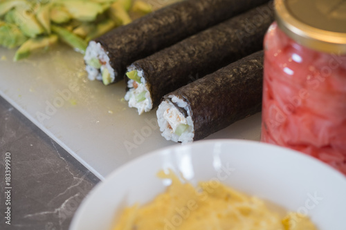 Fresh Homemade Sushi Roll with salmon, rice and nori. closeup