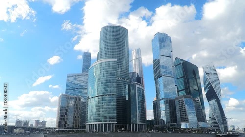 glass skyscrapers on river bank in summer timelapse