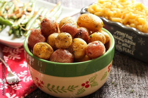 Home cooked baked roasted baby potatoes with herbs/ Xmas thanksgiving side dish, selective focus