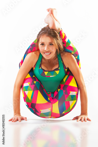 beautiful flexible woman doing yoga poses on white photo