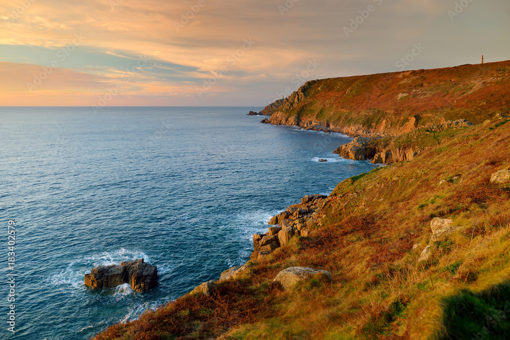 Rugged Cornish coastline at Porth Nanven on sunny evening, Cornwall, England