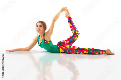 beautiful flexible woman doing yoga poses on white photo