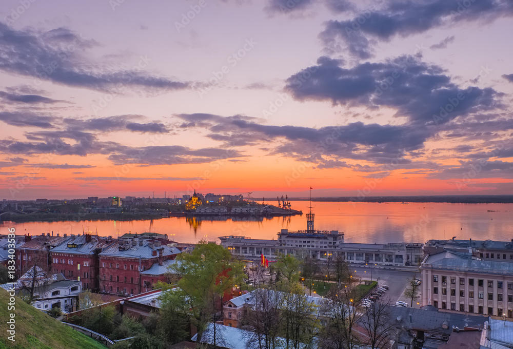 Cityscape of Nizhny Novgorod  to the Volga River and the mouth of the Oka River  in the twilight after sunset