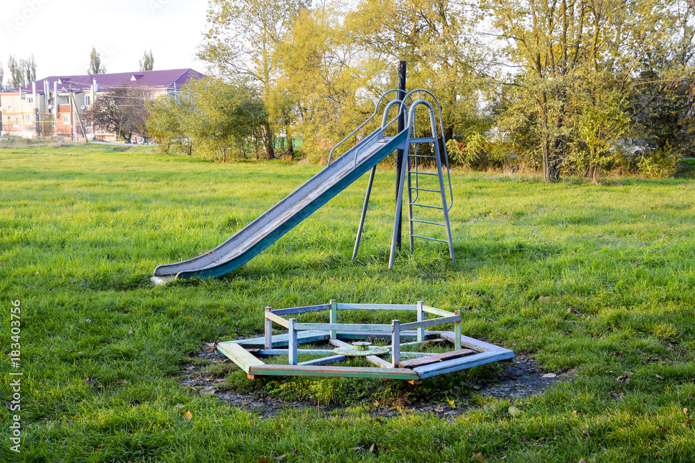 Children playground. Swings and a slide to slide Children playground. Swings and a slide to slide