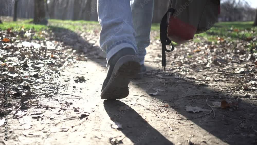 Old man walks along an autumn park on a sunny day. Old man walks along an autumn park on a sunny day.