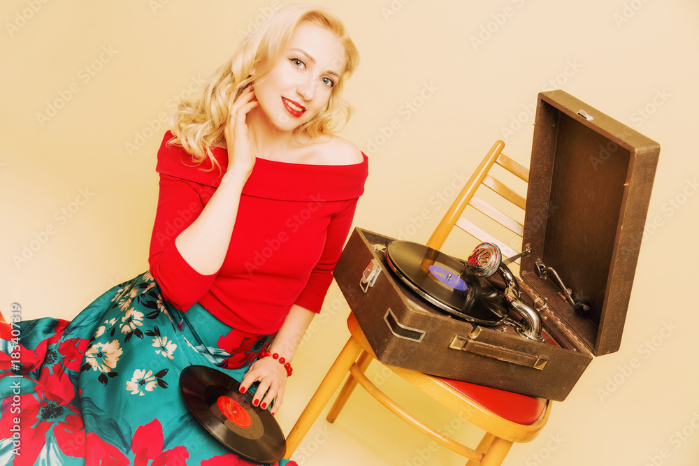 beautiful young woman with gramophone