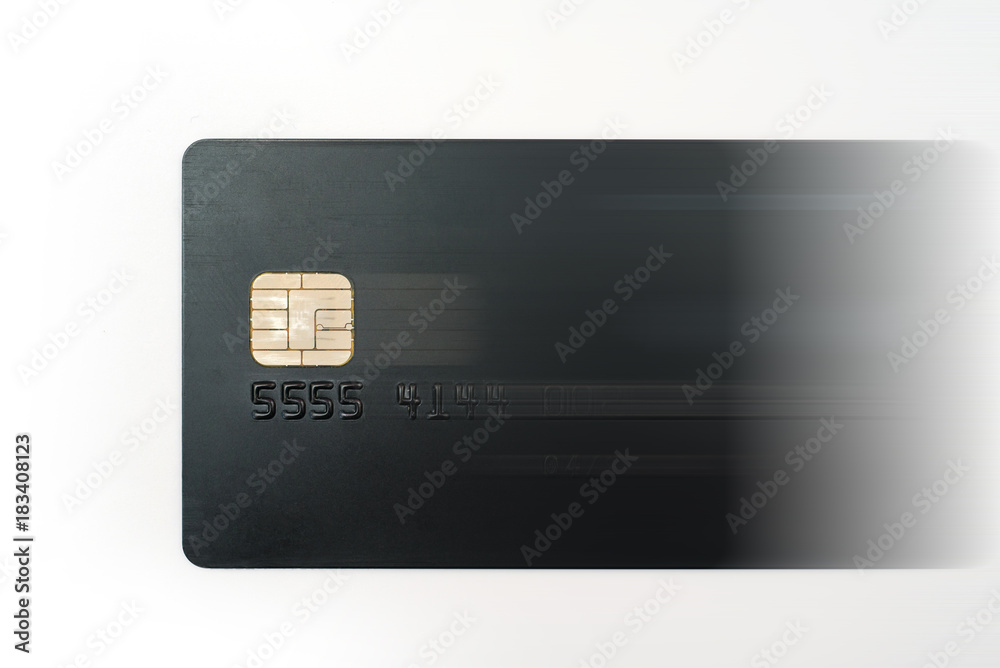 Black credit card motion blurred to the right Black credit card motion blurred to the right
