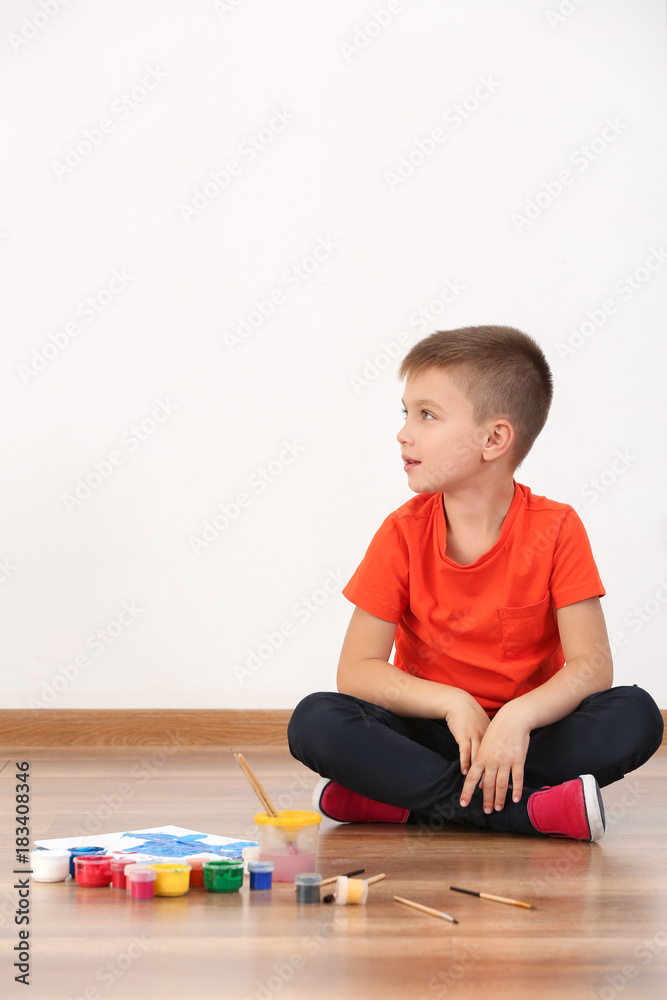 Cute boy painting picture on sheet of paper, indoors Cute boy painting picture on sheet of paper, indoors