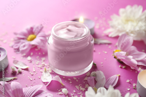 Beautiful composition with jar of body cream on color background