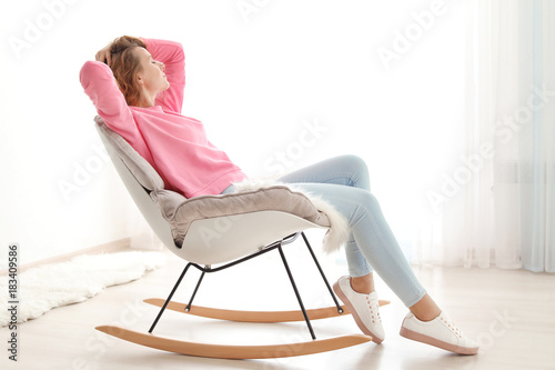 Happy young woman relaxing ...