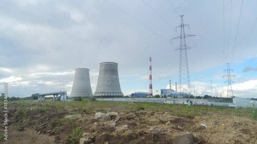 Factory pipes and power towers in summer timelapse Factory pipes and power towers in summer timelapse