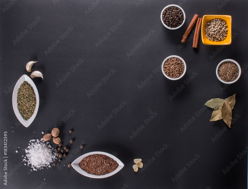 Fresh vegetables, Spices and herbs scattered on dark background. Natural and bio ingredients for cooking. Organic products. Top view and copy space for your text.