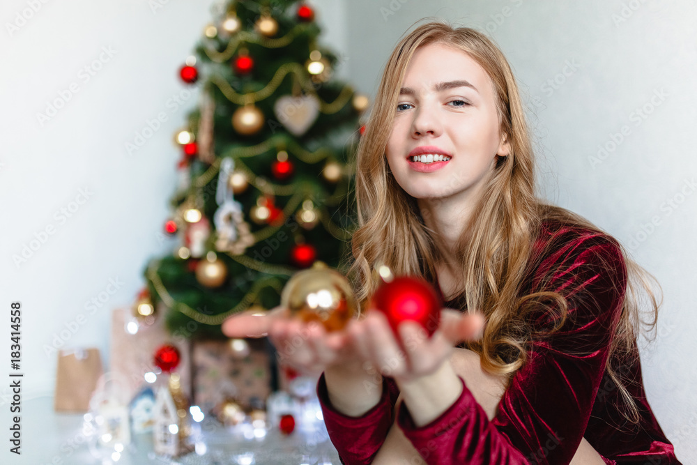 Christmas Woman. Portrait of a girl. Girl smiling. Girl celebrates Christmas