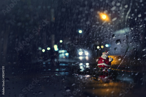 Merry Christmas and happy holidays concept background.View through the window of strong rain.