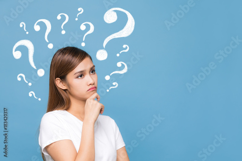 Young woman having questions.