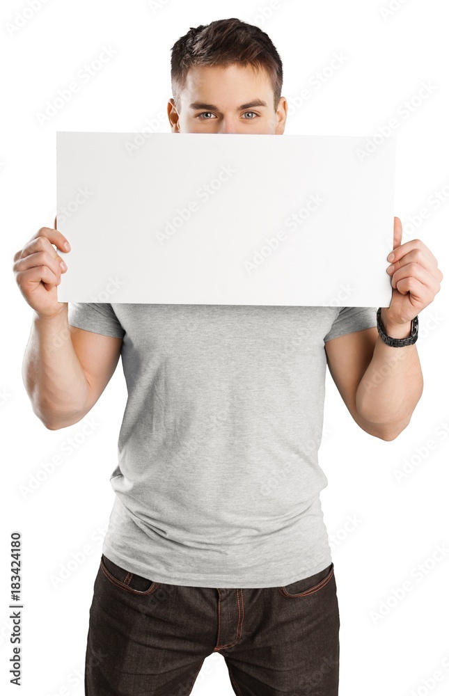 young man holding a blank banner young man holding a blank banner
