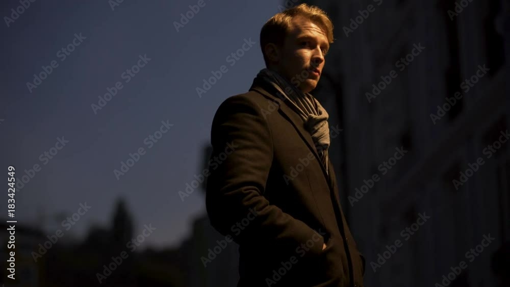 Sad man standing alone in the street after his girlfriend left him, depression